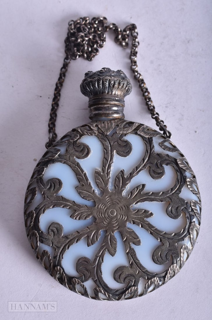 AN ART NOUVEAU SILVER OVERLAID OPALESCENT GLASS SCENT BOTTLE. 38.5 grams. 6.5 cm x 4.75 cm. (1 of 3)