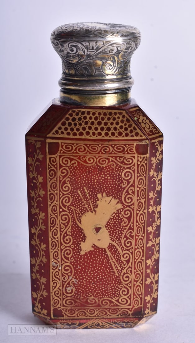 A VICTORIAN SILVER AND RUBY GLASS GILDED SCENT BOTTLE. 90 grams. 8.25 cm x 3.75 cm.: A VICTORIAN SILVER AND RUBY GLASS GILDED SCENT BOTTLE. 90 grams. 8.25 cm x 3.75 cm.
