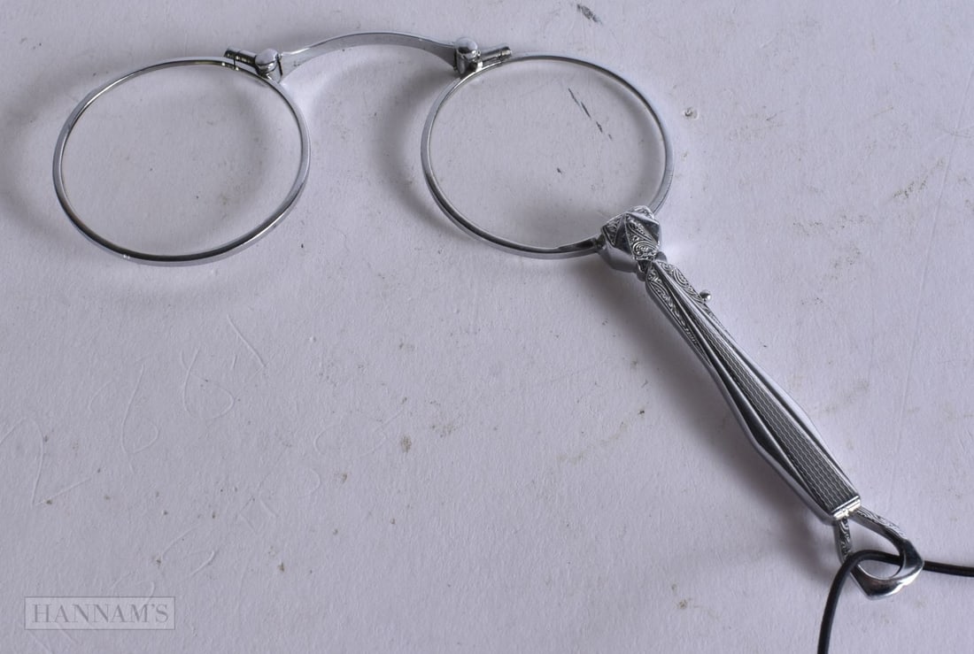 A PAIR OF WHITE METAL LORGNETTES. 12 cm x 9 cm. (1 of 1)
