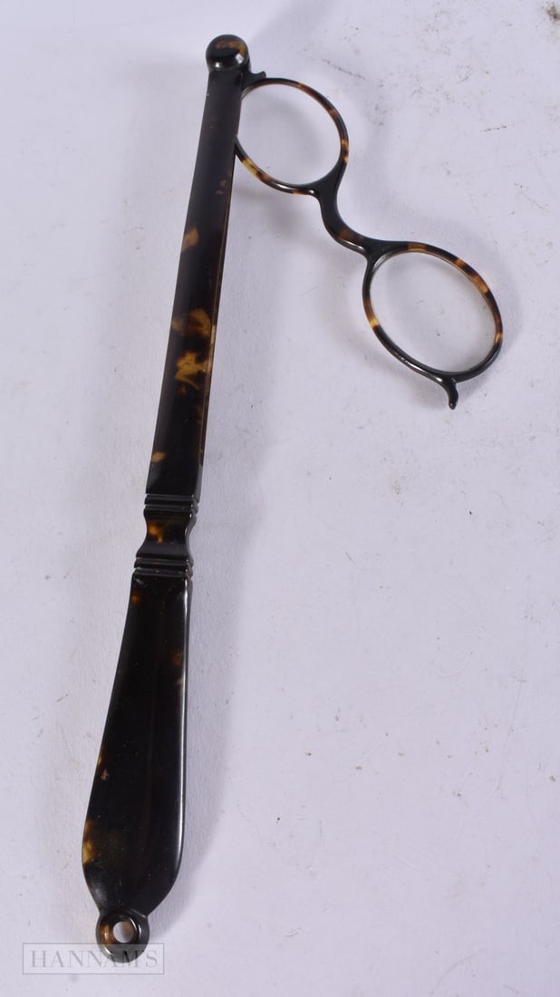 A PAIR OF ANTIQUE TORTOISESHELL LORGNETTES. 32 cm long. (1 of 1)