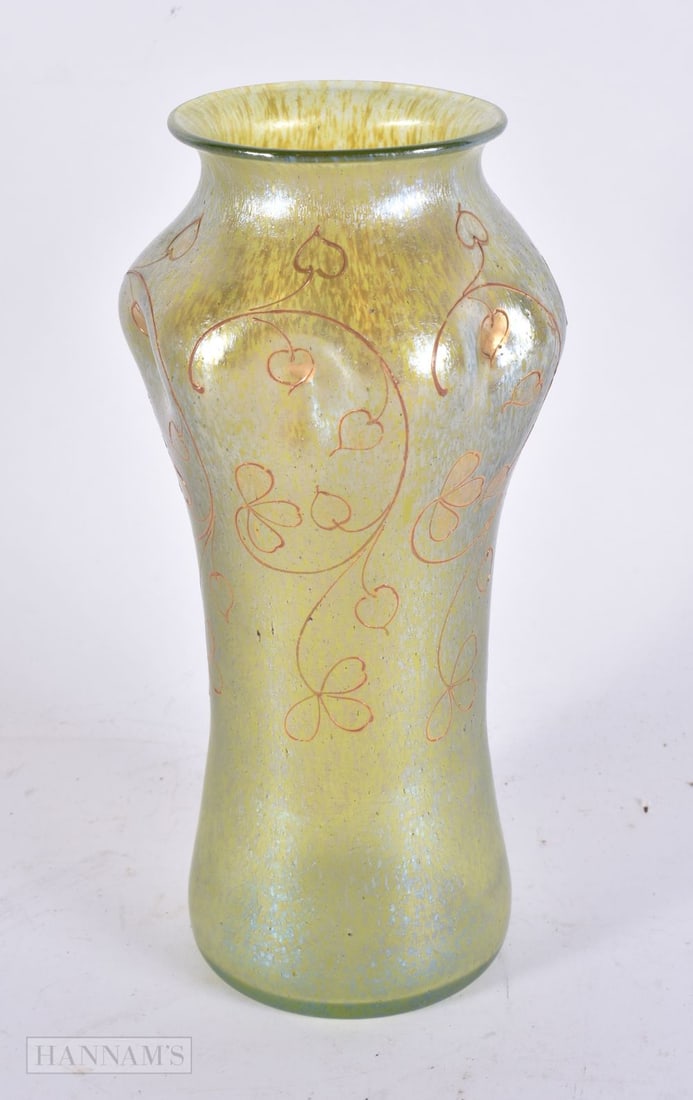 A STYLISH AUSTRIAN IRIDESCENT GLASS VASE possibly Loetz, gilded with floral sprays. 23 cm high. (1 of 4)