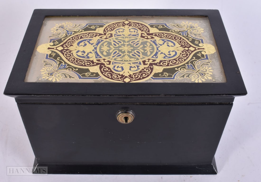 AN EARLY VICTORIAN TOLEWARE EGLOMISE GLASS TOPPED TEA CADDY. 18 cm x 12 cm.: AN EARLY VICTORIAN TOLEWARE EGLOMISE GLASS TOPPED TEA CADDY. 18 cm x 12 cm.