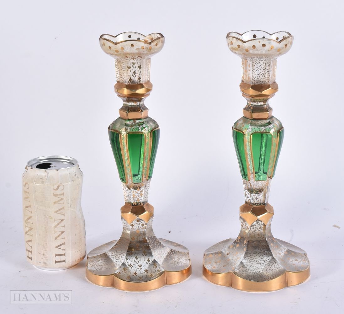 A PAIR OF 19TH CENTURY BOHEMIAN GREEN AND GILT GLASS CANDLESTICKS. 25 cm high.: A PAIR OF 19TH CENTURY BOHEMIAN GREEN AND GILT GLASS CANDLESTICKS. 25 cm high.