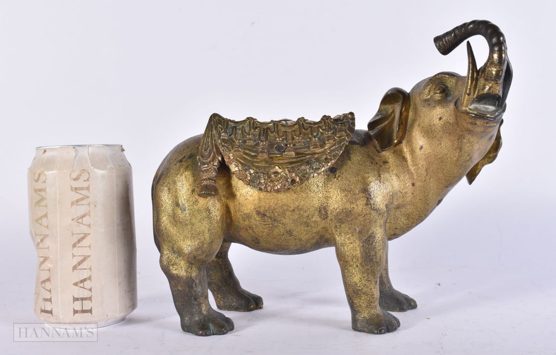 A FINE EARLY 19TH CENTURY GILT BRONZE ELEPHANT modelled with trunk raised. 21 cm x 17 cm.: A FINE EARLY 19TH CENTURY GILT BRONZE ELEPHANT modelled with trunk raised. 21 cm x 17 cm.