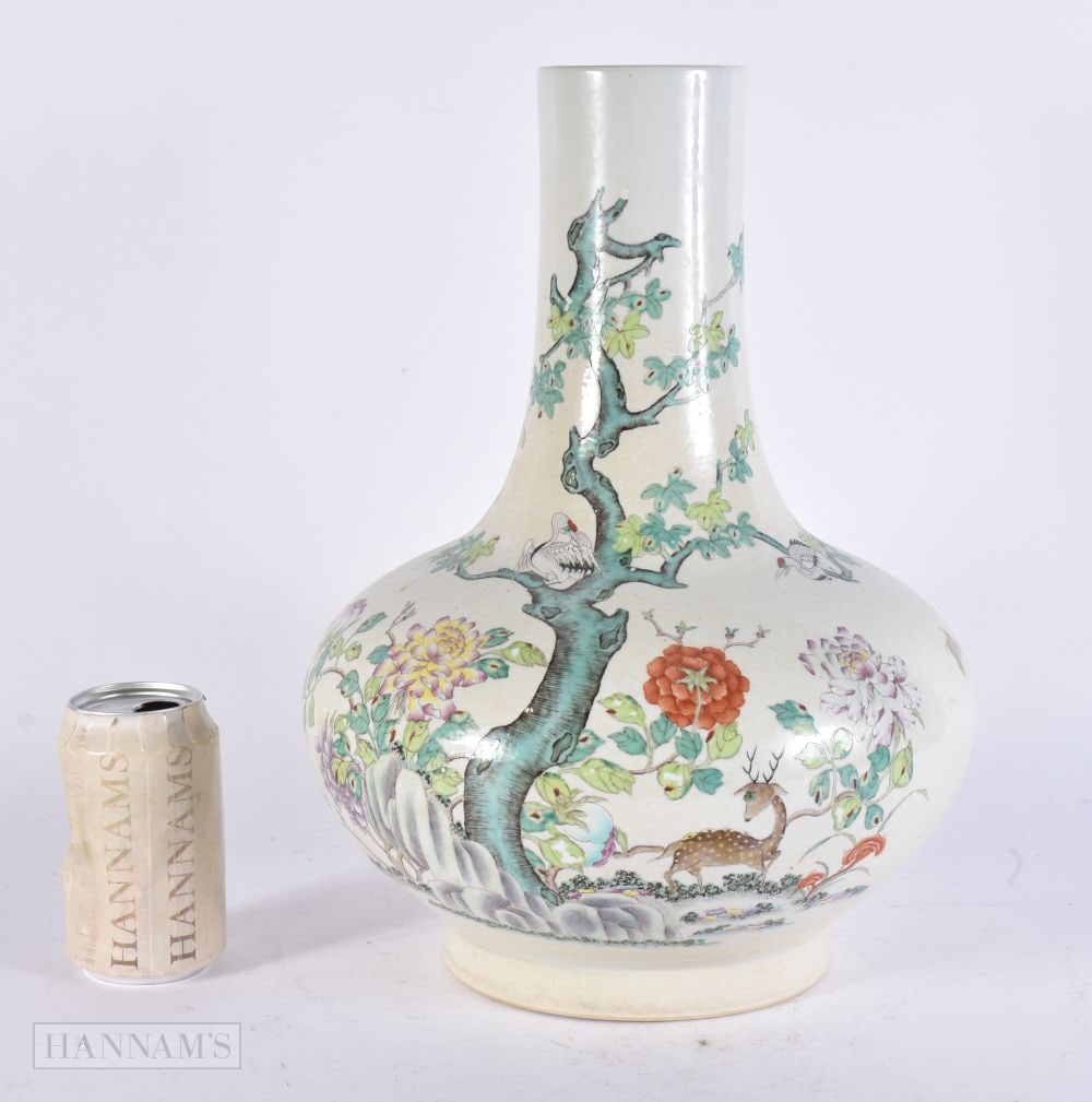 A LARGE CHINESE FAMILLE ROSE PORCELAIN BULBOUS VASE painted with spotted deer within a landscape. 38: A LARGE CHINESE FAMILLE ROSE PORCELAIN BULBOUS VASE painted with spotted deer within a landscape. 38 cm x 24 cm.