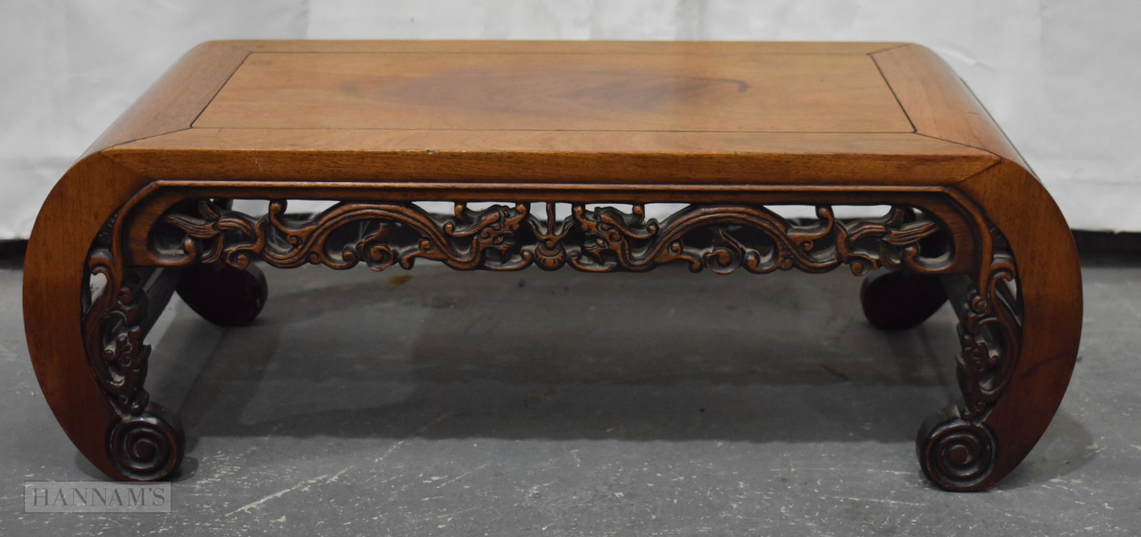 A 19TH CENTURY CHINESE CARVED HUANGHUALI LOW SCROLLING TABLE Qing. 74 cm x 36 cm x 25 cm. (1 of 4)