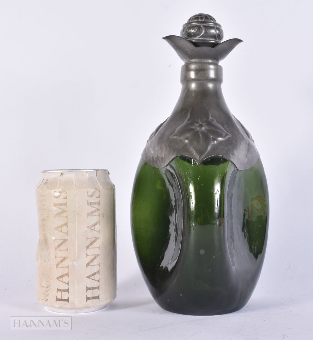A PEWTER OVERLAID GREEN GLASS BOTTLE DECANTER. 24.5 cm high. (1 of 5)