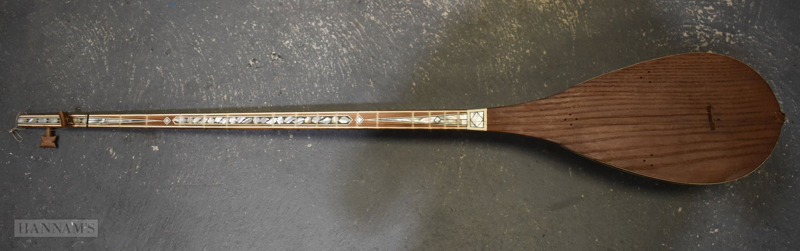 A TURKISH CARVED WOOD SIMULATED BONE SAZ MUSICAL INSTRUMENT. 118 cm long.: A TURKISH CARVED WOOD SIMULATED BONE SAZ MUSICAL INSTRUMENT. 118 cm long.
