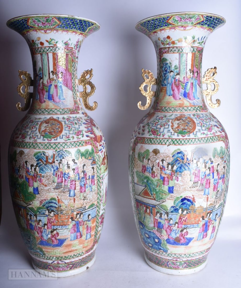 A LARGE PAIR OF 19TH CENTURY CHINESE CANTON FAMILLE ROSE PORCELAIN VASES. 64 cm high, (1 of 4)