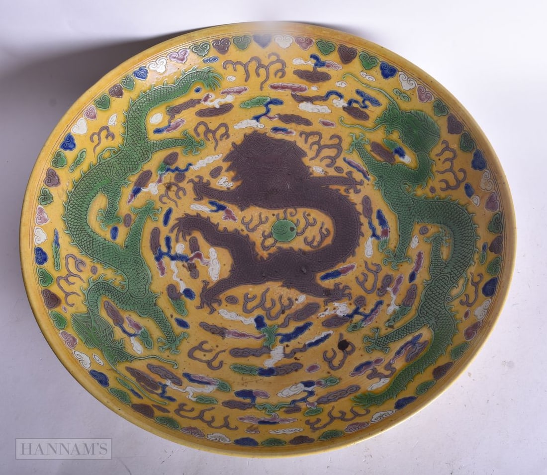 A CHINESE YELLOW GROUND GREEN AND AUBERGINE DRAGON DISH. 30.5 cm diameter.: A CHINESE YELLOW GROUND GREEN AND AUBERGINE DRAGON DISH. 30.5 cm diameter.