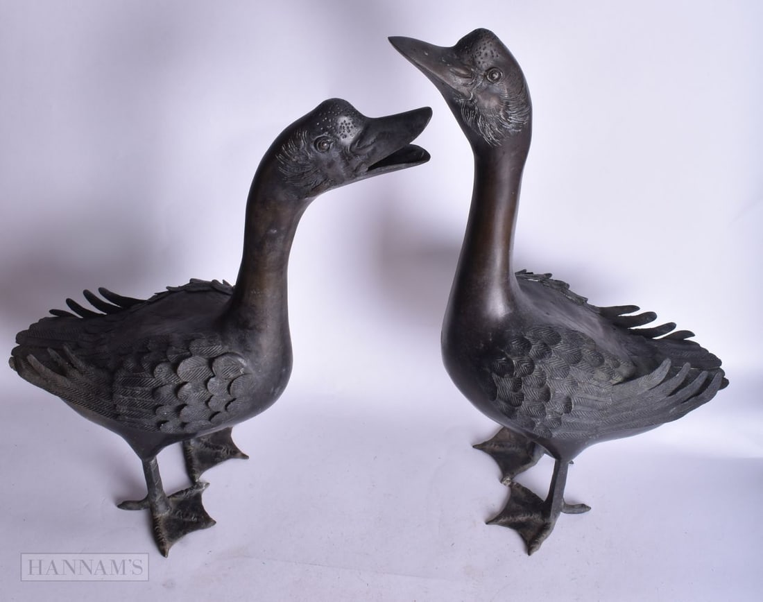 A LARGE PAIR OF EARLY 20TH CENTURY JAPANESE BRONZE WATERFOWL. 45 x 25 cm. (1 of 3)