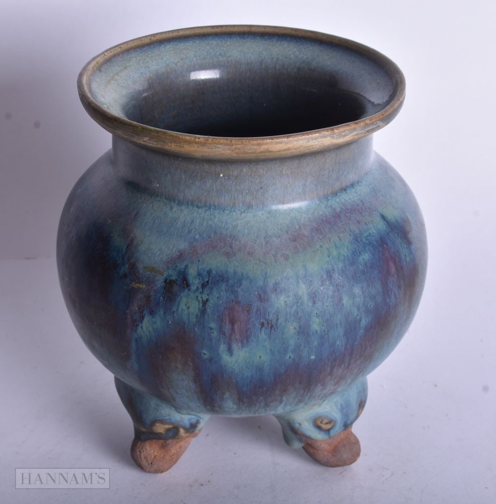 A CHINESE JUN STYLE PURPLE SPLASHED TRIPOD CENSER. 13 cm high.: A CHINESE JUN STYLE PURPLE SPLASHED TRIPOD CENSER. 13 cm high.