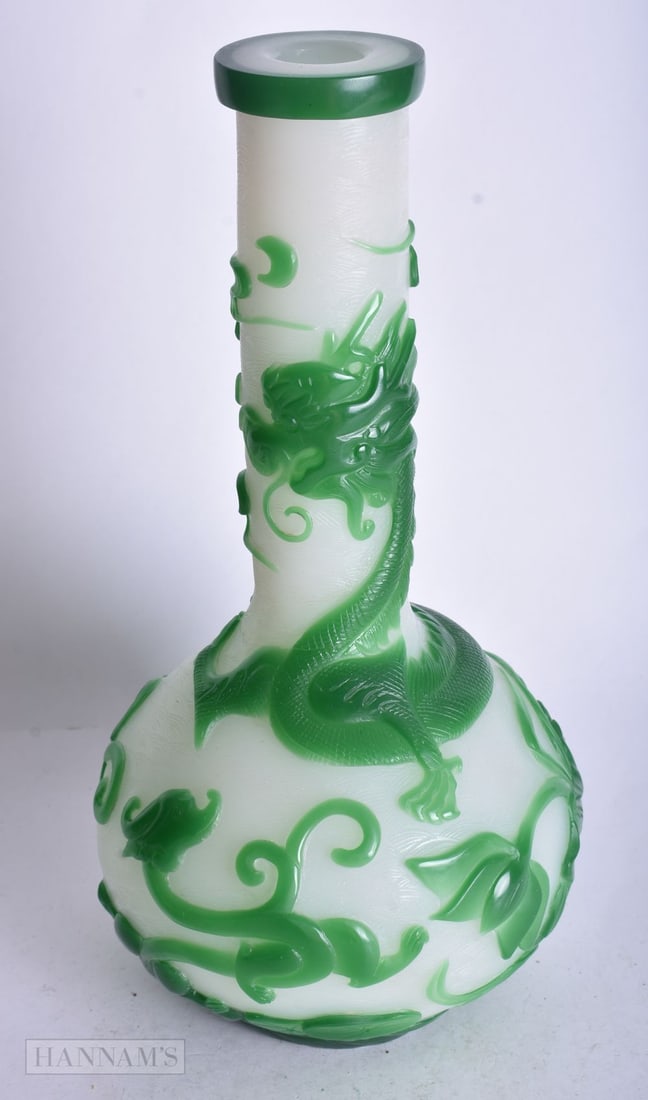 A CHINESE PEKING GLASS VASE WITH A GREEN DRAGON AND FLORAL OVERLAY. 27.5 cm high.: A CHINESE PEKING GLASS VASE WITH A GREEN DRAGON AND FLORAL OVERLAY. 27.5 cm high.