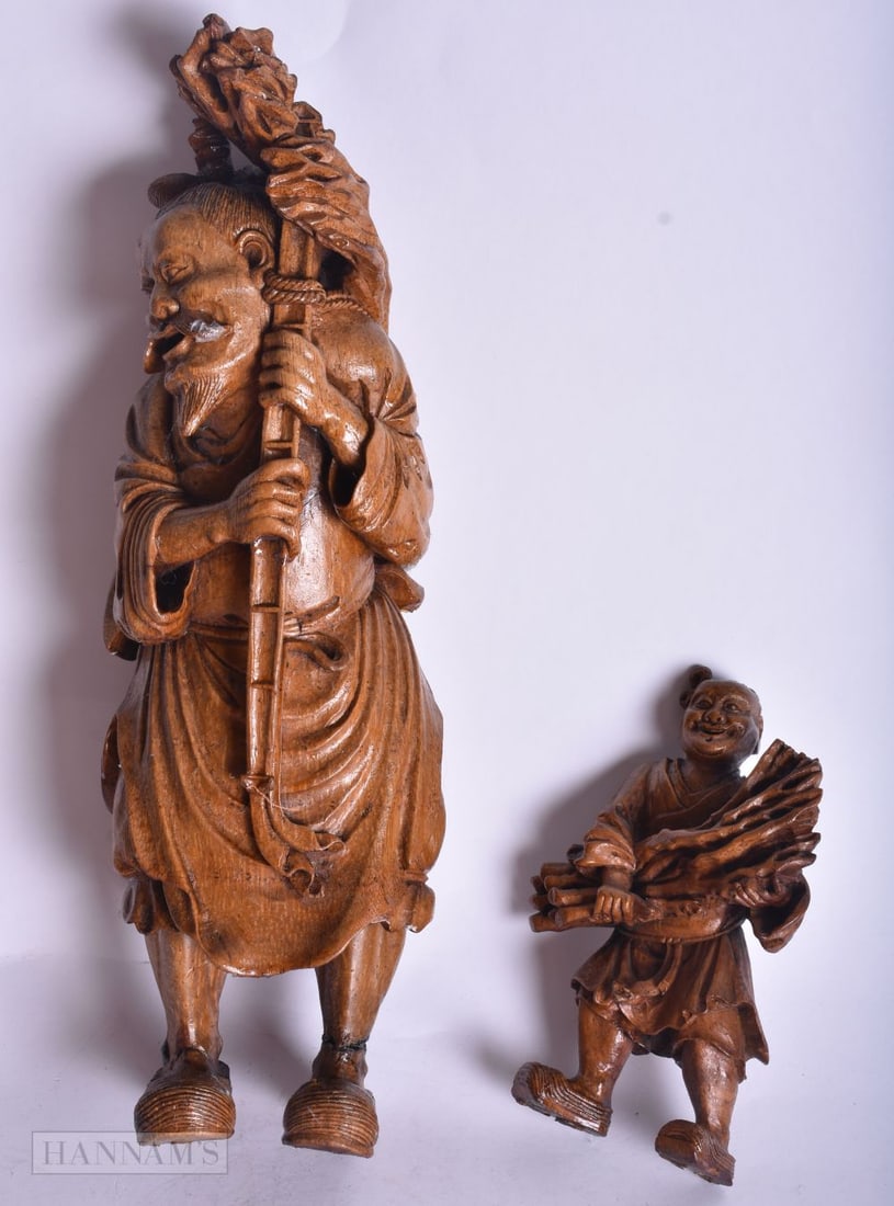 TWO CHINESE WOOD FIGURES OF MALES CARRYING FIRE WOOD. 31 cm high. (2) (1 of 4)