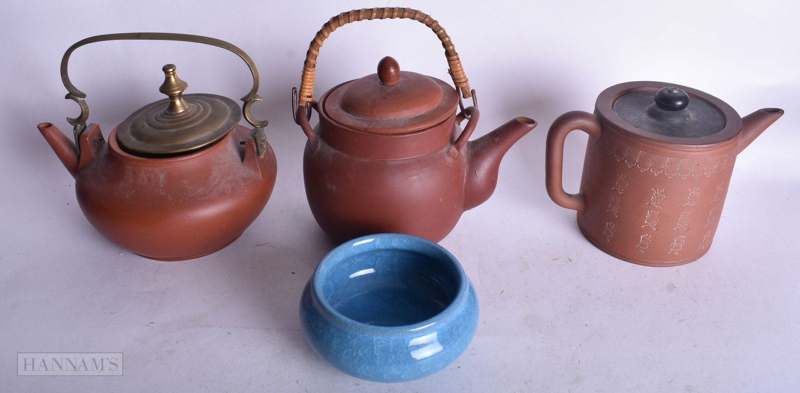 THREE CHINESE YIXING TEAPOTS TOGETHER WITH A PORCELAIN CENSER. 16 x 16 cm. (4): THREE CHINESE YIXING TEAPOTS TOGETHER WITH A PORCELAIN CENSER. 16 x 16 cm. (4)