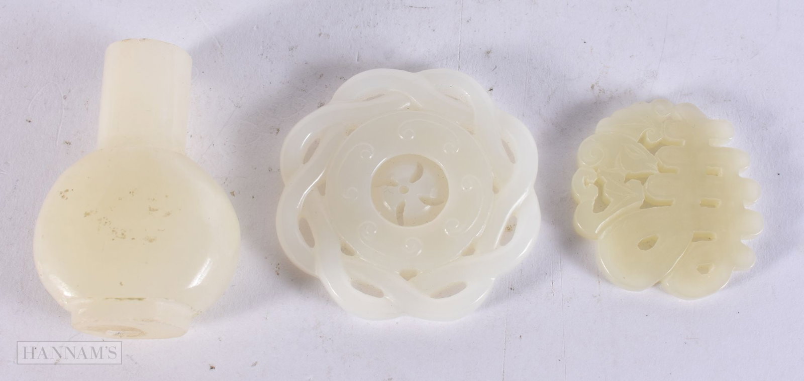 THREE CHINESE WHITE JADE CARVINGS including a miniature snuff bottle and two reticulated plaques. 6 (1 of 2)