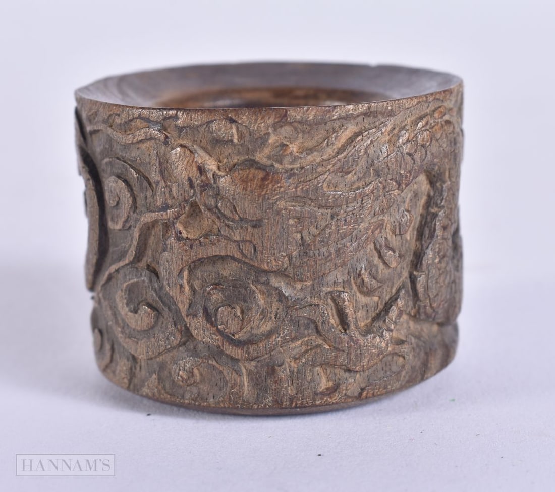 AN UNUSUAL CHINESE CARVED WOOD ARCHERS RING possibly Chenxiang. 3.75 cm wide.: AN UNUSUAL CHINESE CARVED WOOD ARCHERS RING possibly Chenxiang. 3.75 cm wide.