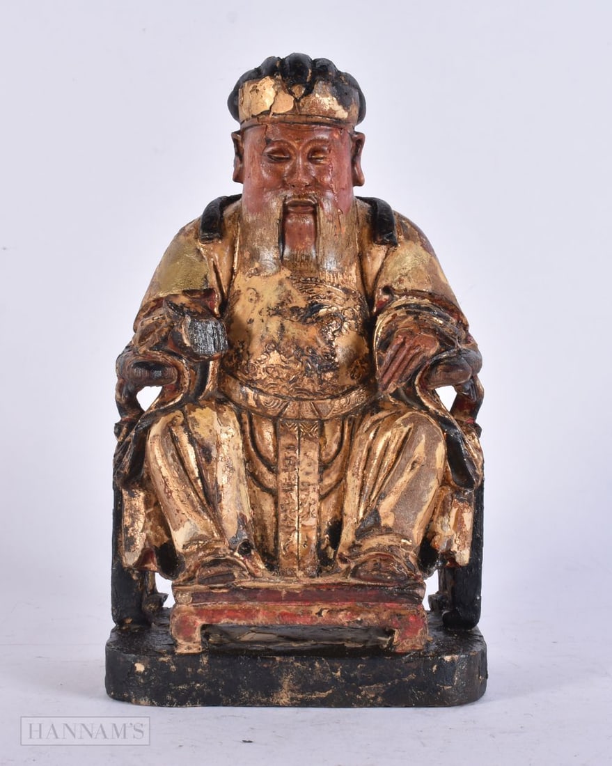 A CHINESE QING DYNASTY POLYCHROMED WOOD FIGURE OF A SCHOLAR. 22 cm x 9 cm.: A CHINESE QING DYNASTY POLYCHROMED WOOD FIGURE OF A SCHOLAR. 22 cm x 9 cm.