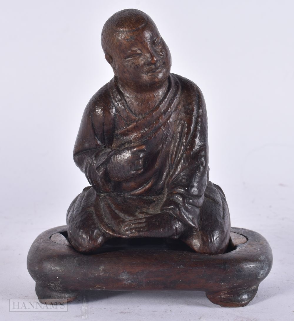 A CHINESE QING DYNASTY CARVED BAMBOO FIGURE OF A SCHOLAR. 9.5 cm x 6.5 cm.: A CHINESE QING DYNASTY CARVED BAMBOO FIGURE OF A SCHOLAR. 9.5 cm x 6.5 cm.
