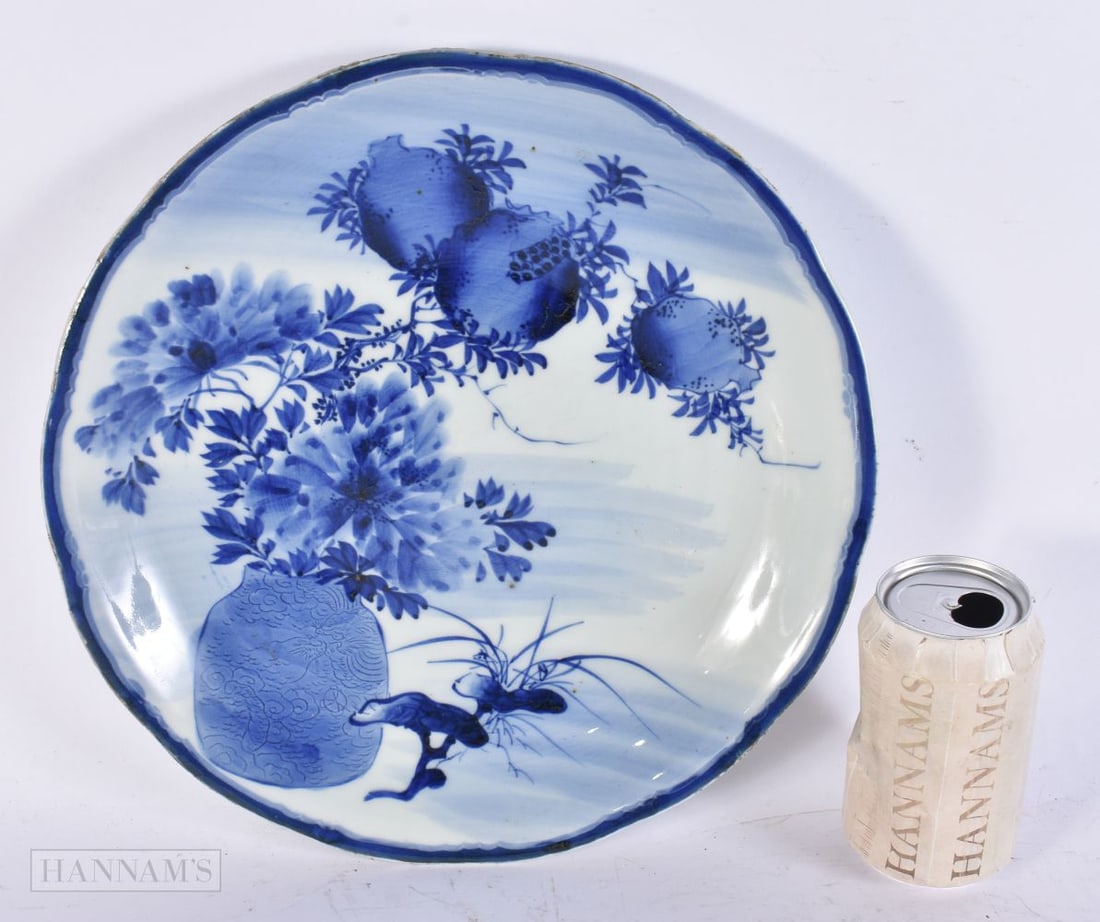 A LARGE 18TH CENTURY JAPANESE EDO PERIOD BLUE AND WHITE PORCELAIN DISH painted with an urn of flower (1 of 5)