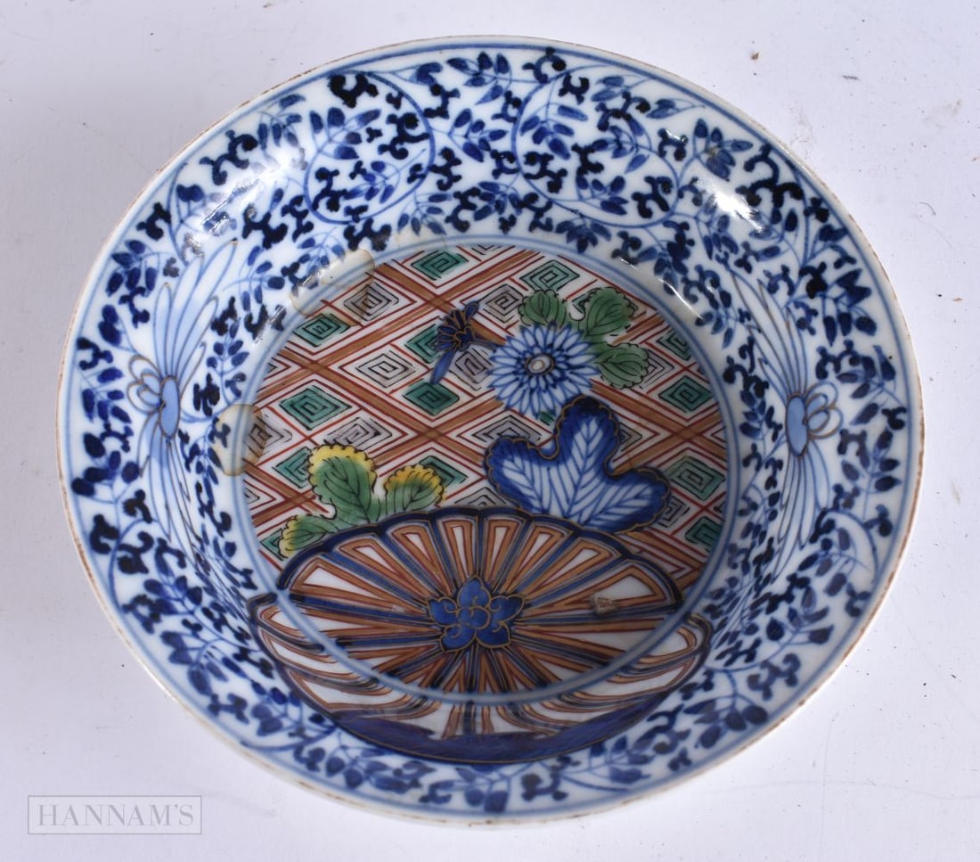 A 19TH CENTURY JAPANESE MEIJI PERIOD BLUE AND WHITE PORCELAIN BOWL painted with flowers. 14.5 cm wid: A 19TH CENTURY JAPANESE MEIJI PERIOD BLUE AND WHITE PORCELAIN BOWL painted with flowers. 14.5 cm wide.