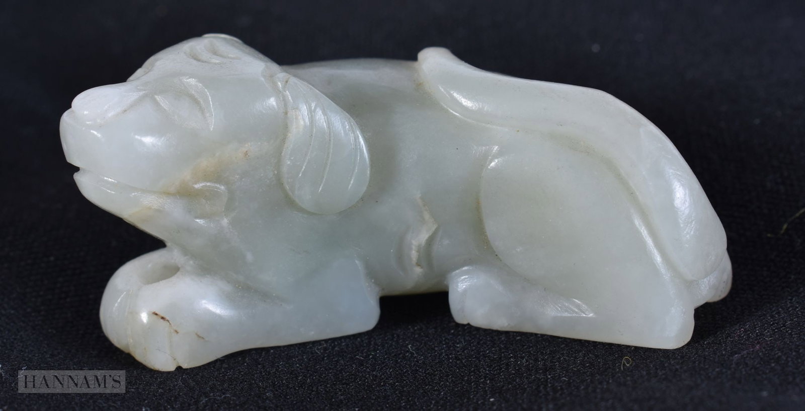 A LATE 19TH CENTURY CHINESE CARVED GREENISH WHITE JADE FIGURE OF A DOG. 6 cm x 2.5 cm.: A LATE 19TH CENTURY CHINESE CARVED GREENISH WHITE JADE FIGURE OF A DOG. 6 cm x 2.5 cm.