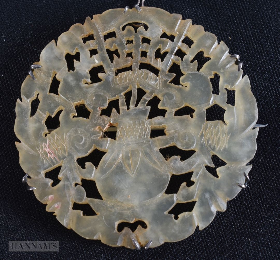 A 19TH CENTURY CHINESE RETICULATED JADE AND SILVER BROOCH Late Qing. 6 cm wide. (1 of 3)
