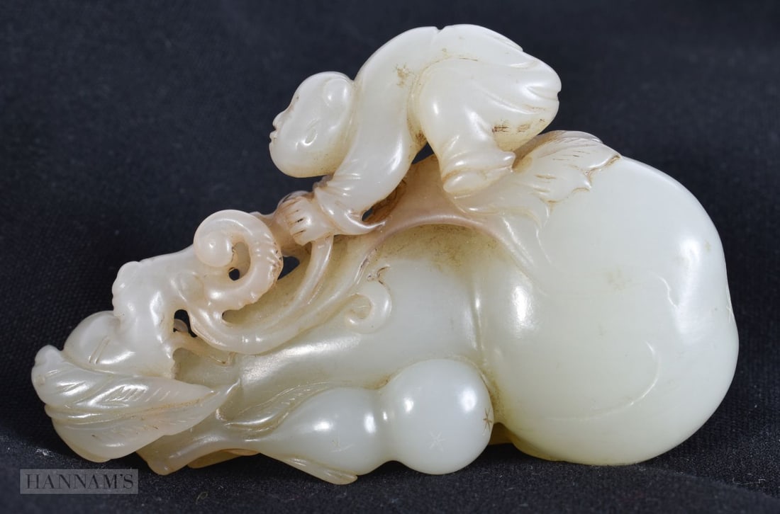 A CHINESE QING DYNASTY CARVED GREENISH WHITE JADE GOURD modelled with clambering child. 9 cm x 5.5 c (1 of 4)