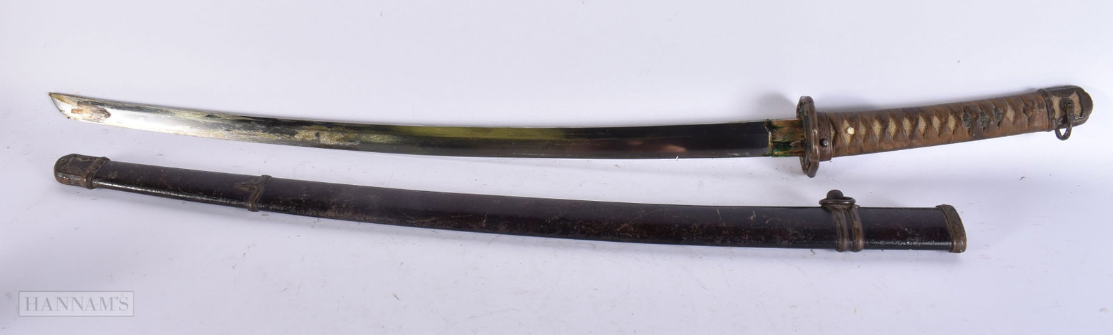 A 19TH CENTURY JAPANESE MEIJI PERIOD SAMURAI SWORD with lacquered metal scabbard. 100 cm long. WE: A 19TH CENTURY JAPANESE MEIJI PERIOD SAMURAI SWORD with lacquered metal scabbard. 100 cm long. WE ARE UNABLE TO OFFER IN-HOUSE SHIPPING ON THIS LOT