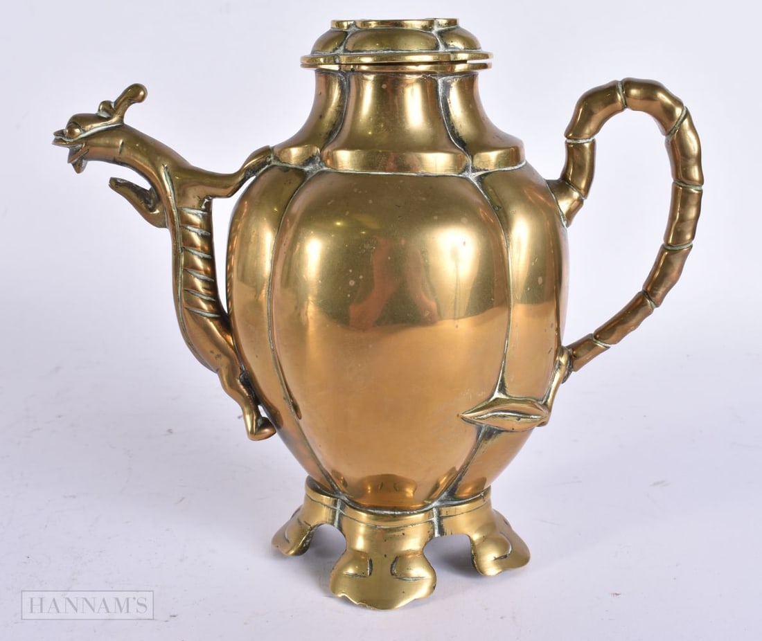 A CHINESE QING DYNASTY BRONZE EWER of lobed form. 18 cm x 16 cm.: A CHINESE QING DYNASTY BRONZE EWER of lobed form. 18 cm x 16 cm.