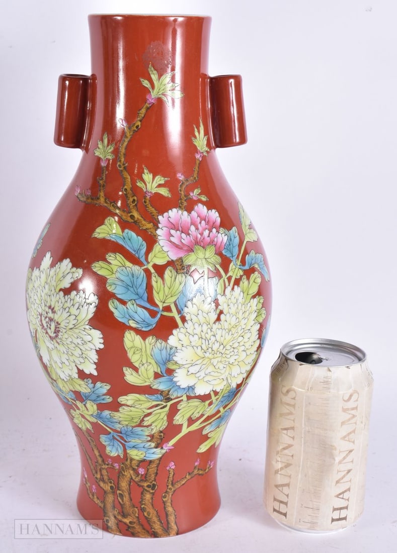 A CHINESE CORAL GROUND PORCELAIN VASE enamelled with flowers. 31.5 cm high. (1 of 7)