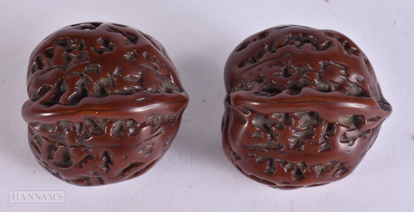 TWO CHINESE QING DYNASTY WALNUTS. 3 cm wide.: TWO CHINESE QING DYNASTY WALNUTS. 3 cm wide.