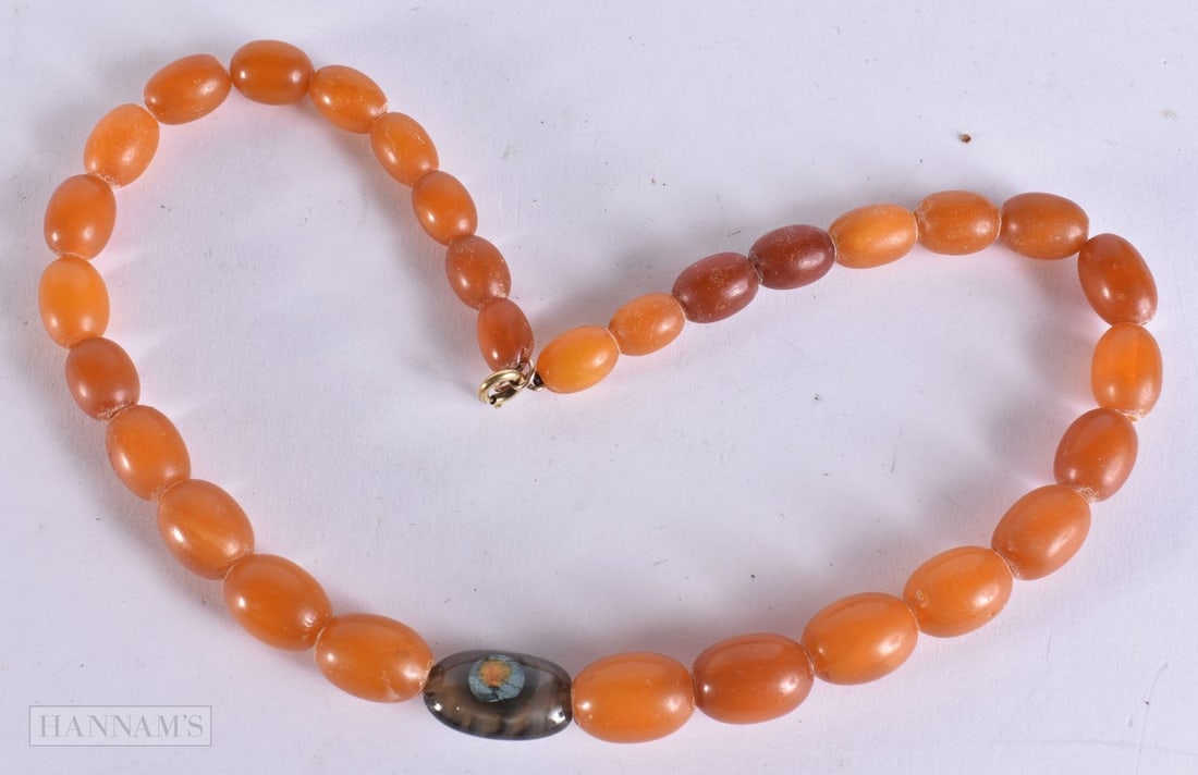 A HARDSTONE NECKLACE. 38 grams. 40 cm long, largest bead 2 cm wide. (1 of 5)