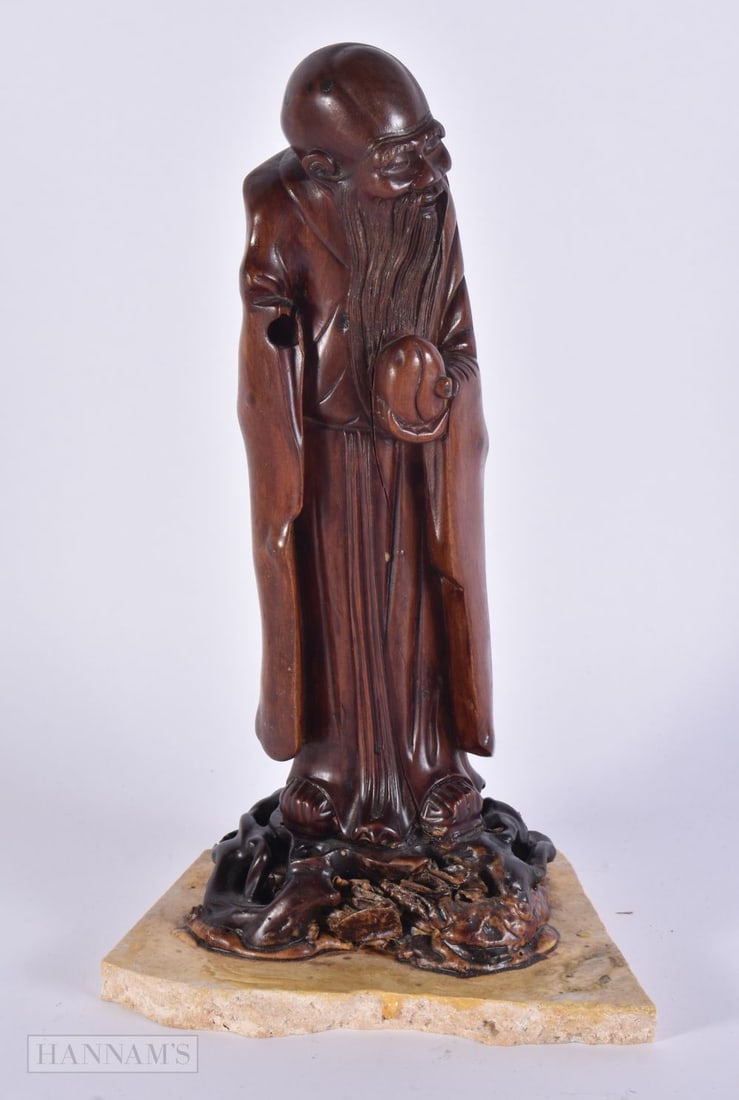 A CHINESE QING DYNASTY CARVED ROOTWOOD FIGURE OF SAGE. 27 cm high.: A CHINESE QING DYNASTY CARVED ROOTWOOD FIGURE OF SAGE. 27 cm high.