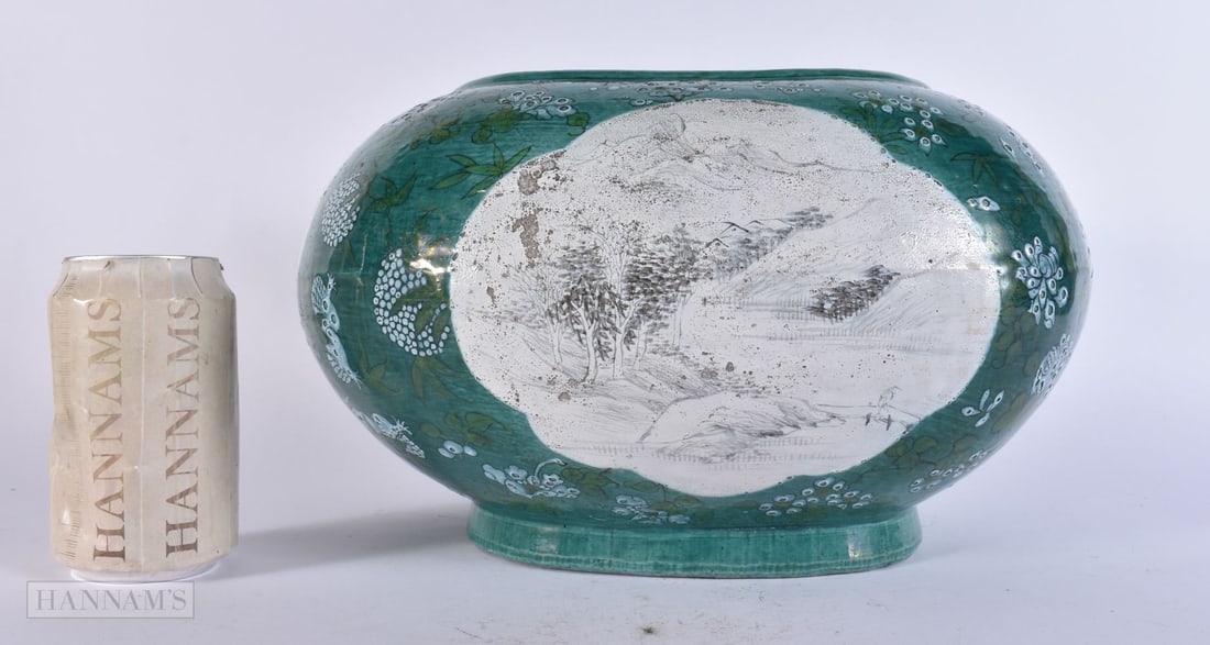 A RARE CHINESE QING DYNASTY GREEN AND EN GRISAILLE ENAMELLED BOWL painted with landscapes. 30 cm x 1: A RARE CHINESE QING DYNASTY GREEN AND EN GRISAILLE ENAMELLED BOWL painted with landscapes. 30 cm x 18 cm.