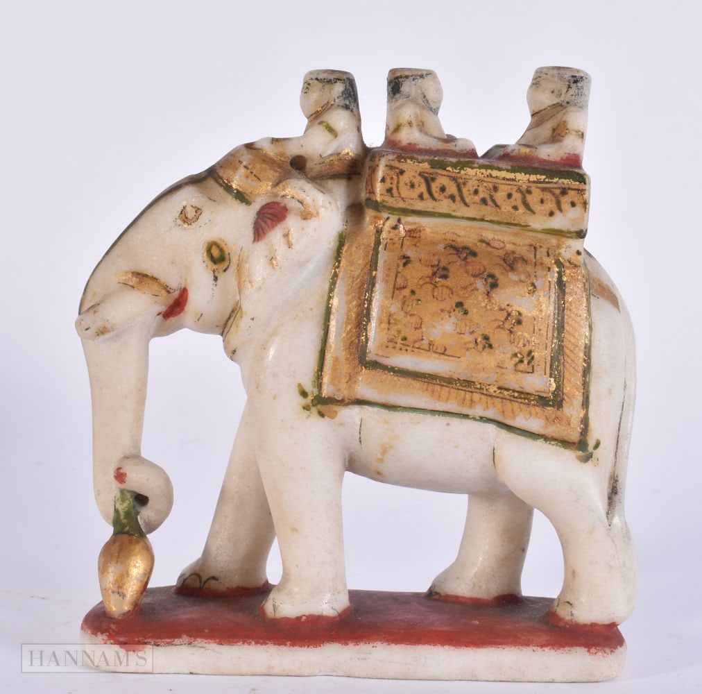 A 19TH CENTURY INDIAN RAJASTHANI PAINTED MARBLE FIGURE OF AN ELEPHANT modelled with attendants. 14 c (1 of 4)