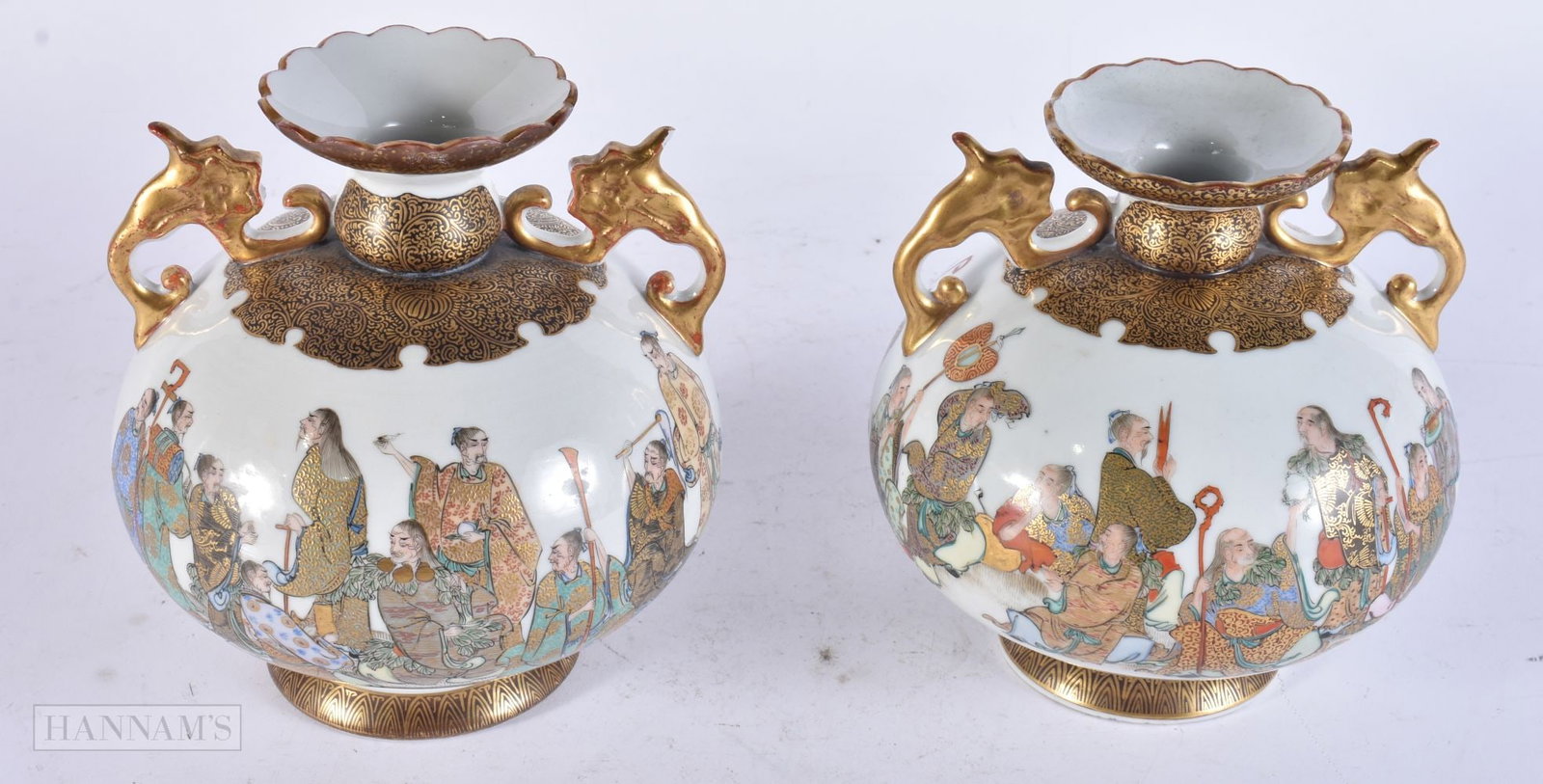 A PAIR OF LATE 19TH CENTURY JAPANESE MEIJI PERIOD KUTANI PORCELAIN VASES painted with immortals. 16: A PAIR OF LATE 19TH CENTURY JAPANESE MEIJI PERIOD KUTANI PORCELAIN VASES painted with immortals. 16 cm x 12 cm.