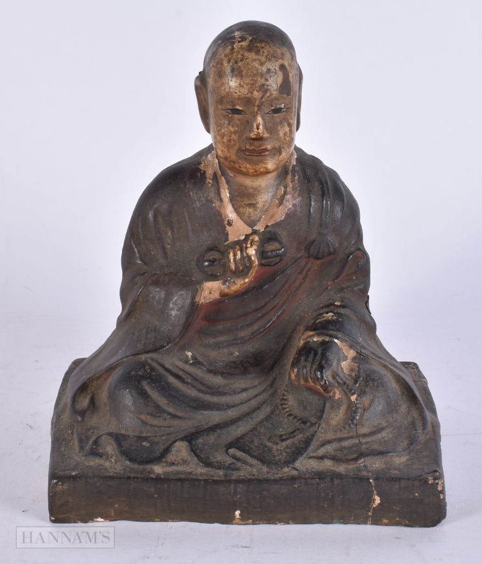 A 17TH CENTURY CHINESE PAINTED POTTERY FIGURE OF AN IMMORTAL Kangxi/Yongzheng. 18 cm x 12 cm. (1 of 4)