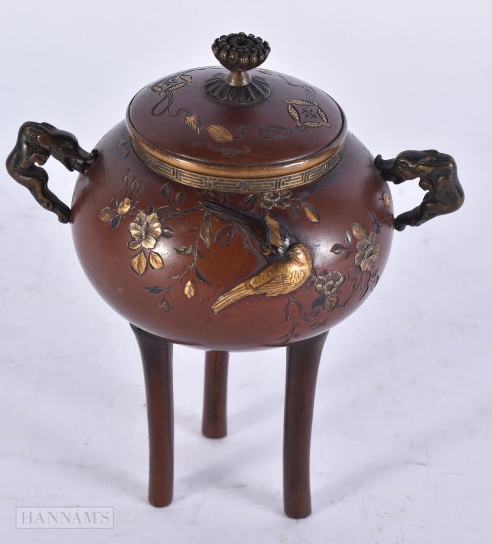 A 19TH CENTURY JAPANESE MEIJI PERIOD ONLAID BRONZE CENSER decorated with birds and foliage. 13.5 cm: A 19TH CENTURY JAPANESE MEIJI PERIOD ONLAID BRONZE CENSER decorated with birds and foliage. 13.5 cm x 8.5 cm.