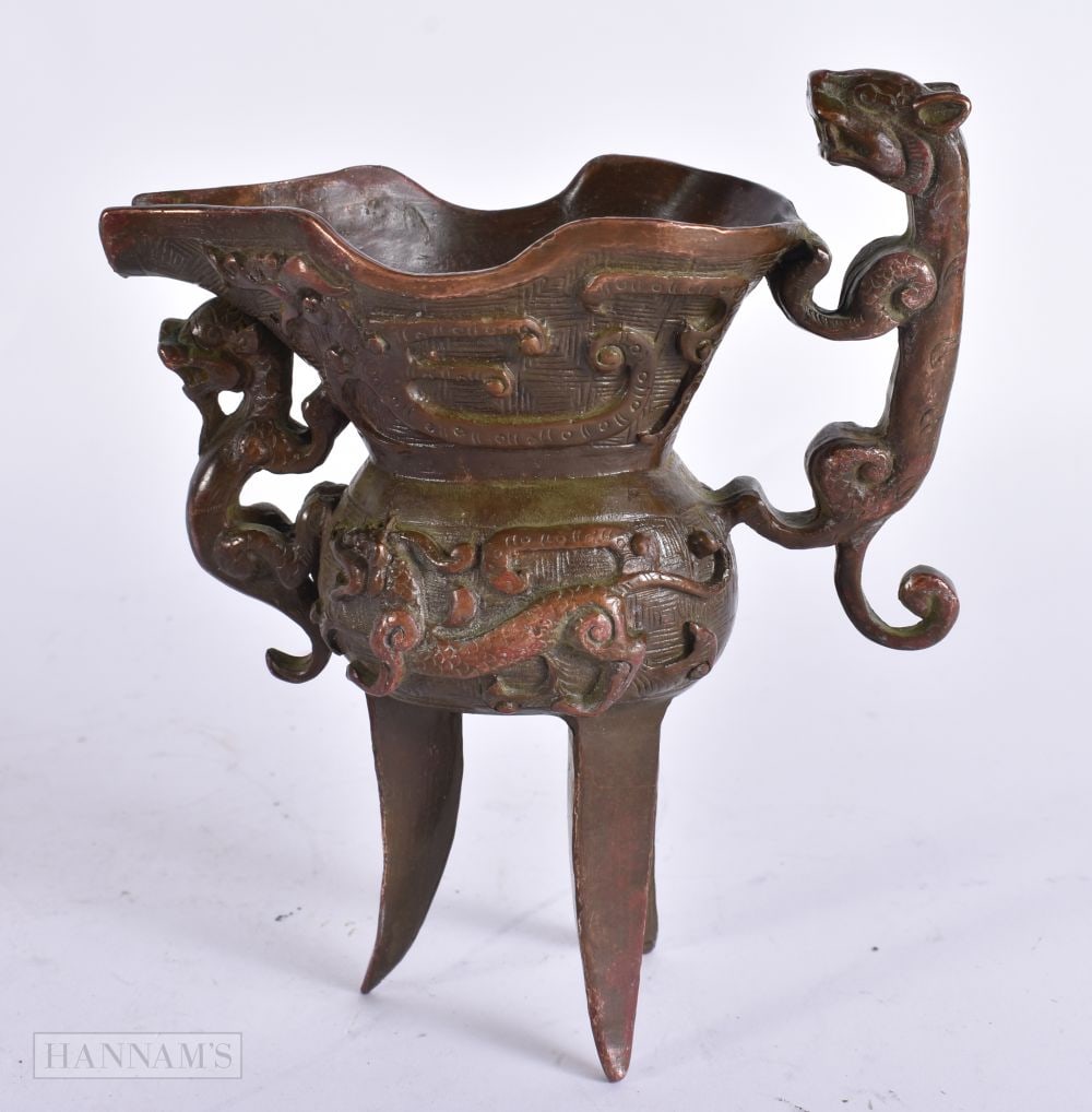 A CHINESE BRONZE JUI VESSEL. 13 cm x 10 cm.: A CHINESE BRONZE JUI VESSEL. 13 cm x 10 cm.