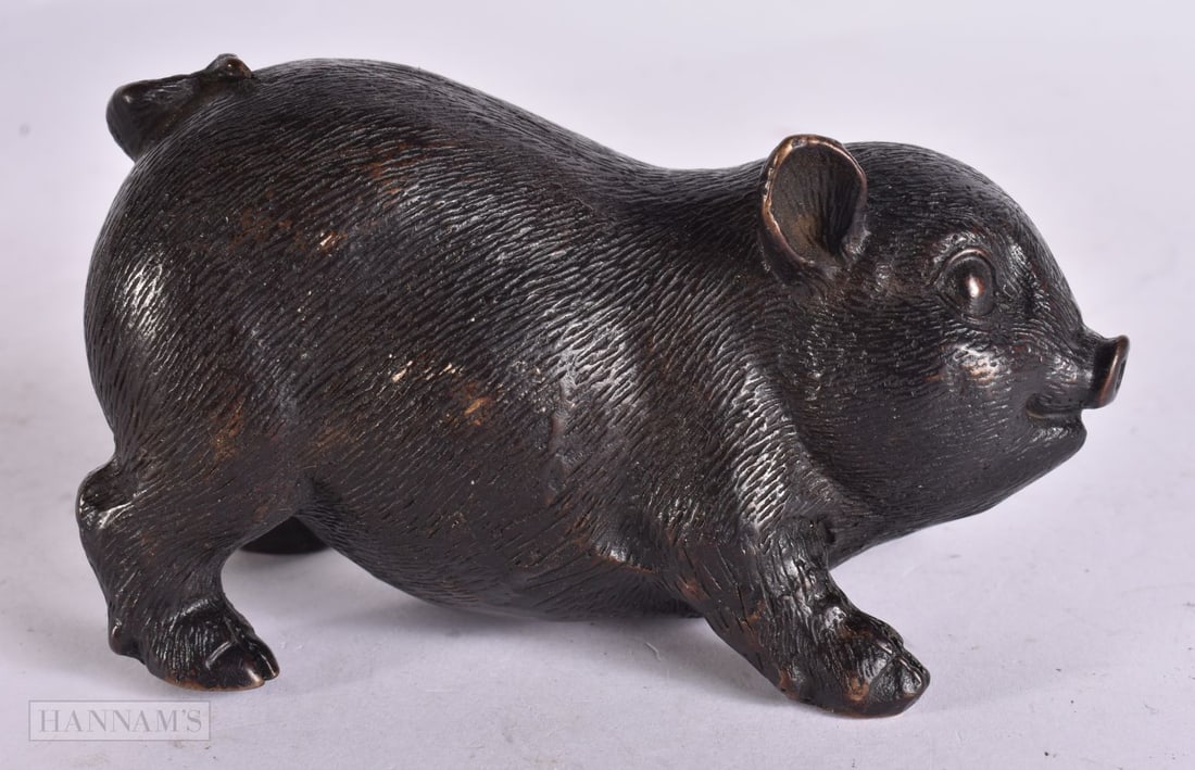 A CHINESE BRONZE PIG. 12 cm wide.: A CHINESE BRONZE PIG. 12 cm wide.