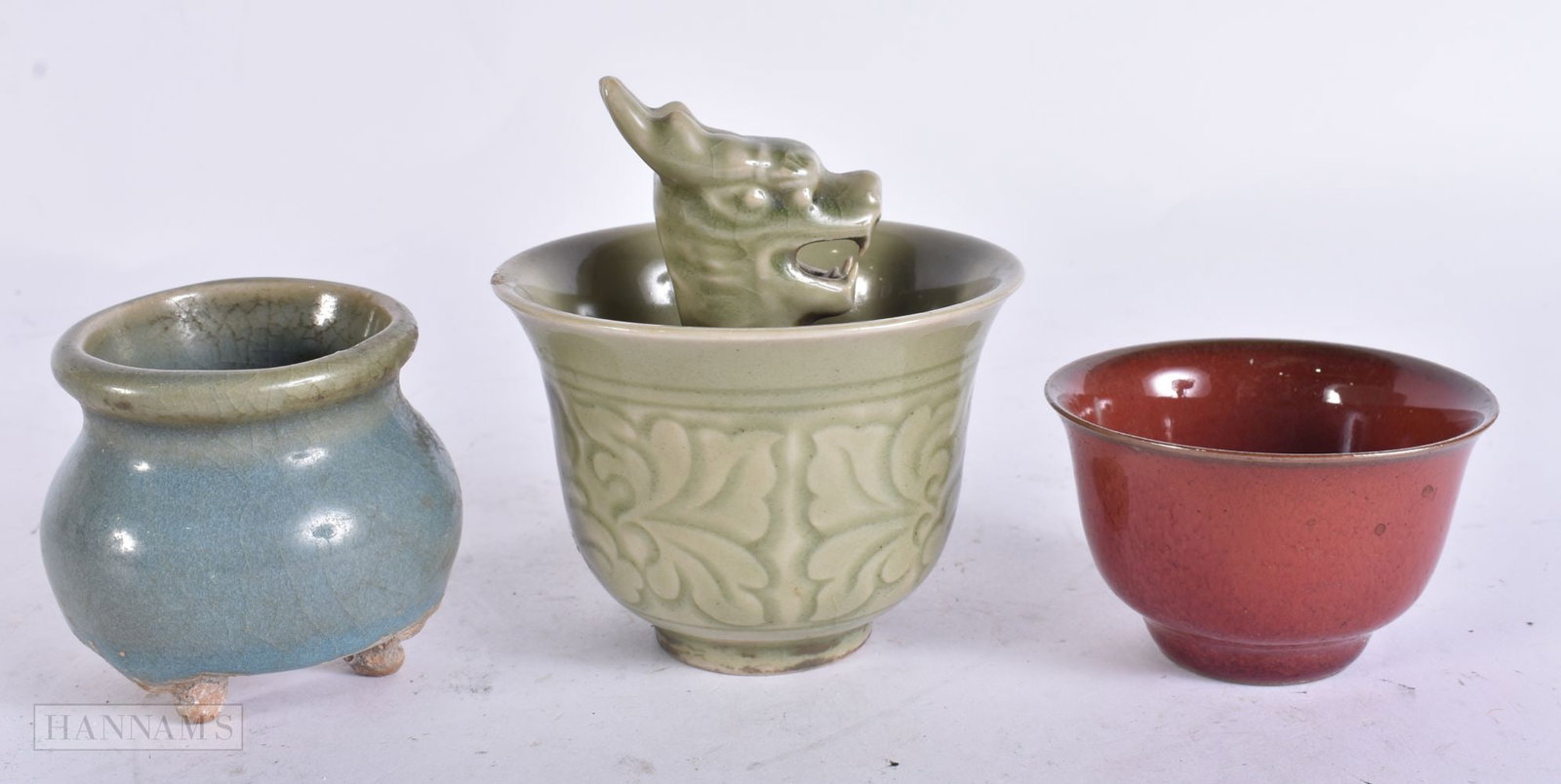 A CHINESE CELADON SURPRISE CUP together with two other bowls. (3) (1 of 4)