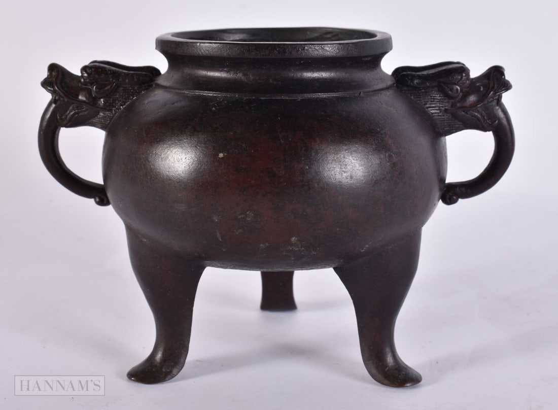 A CHINESE TWIN HANDLED BRONZE CENSER. 16 cm wide. (1 of 5)