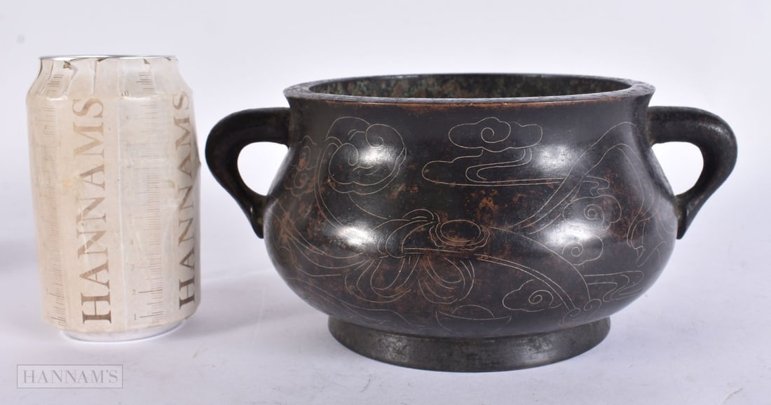 A CHINESE SILVER INLAID BRONZE CENSER. 22 cm wide.: A CHINESE SILVER INLAID BRONZE CENSER. 22 cm wide.