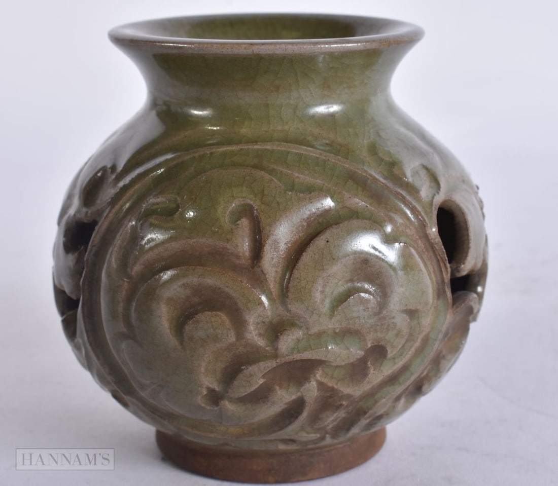 A CHINESE RETICULATED CELADON VASE. 9.25 cm high. (1 of 4)