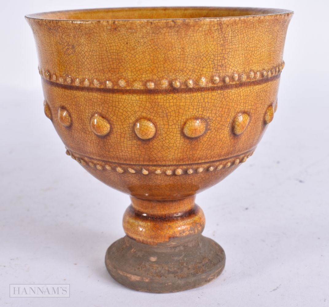 A CHINESE YELLOW GLAZED POTTERY STEM CUP. 11 cm high. (1 of 4)