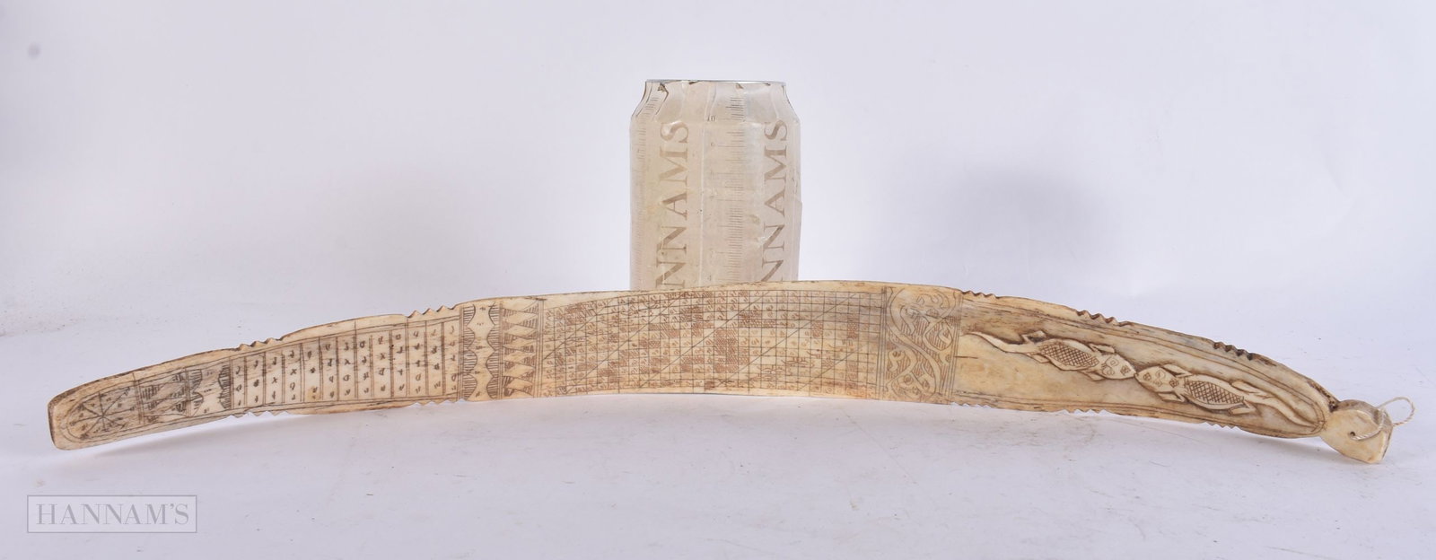 A TRIBAL BONE CARVING. 42 cm wide. (1 of 6)