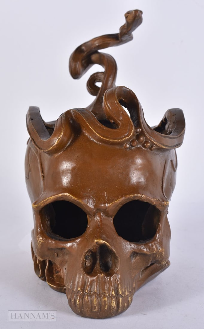 A BRONZE SKULL AND SERPENT. 18 cm x 14 cm.: A BRONZE SKULL AND SERPENT. 18 cm x 14 cm.