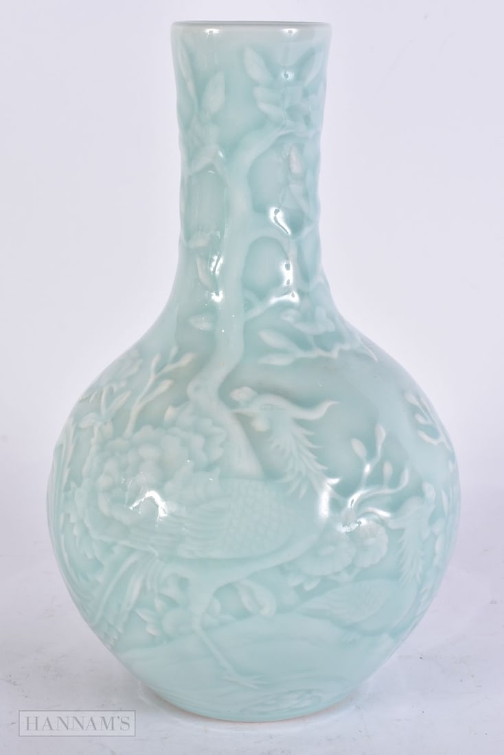 A CHINESE PALE BLUE GLAZED VASE. 23 cm high. (1 of 5)
