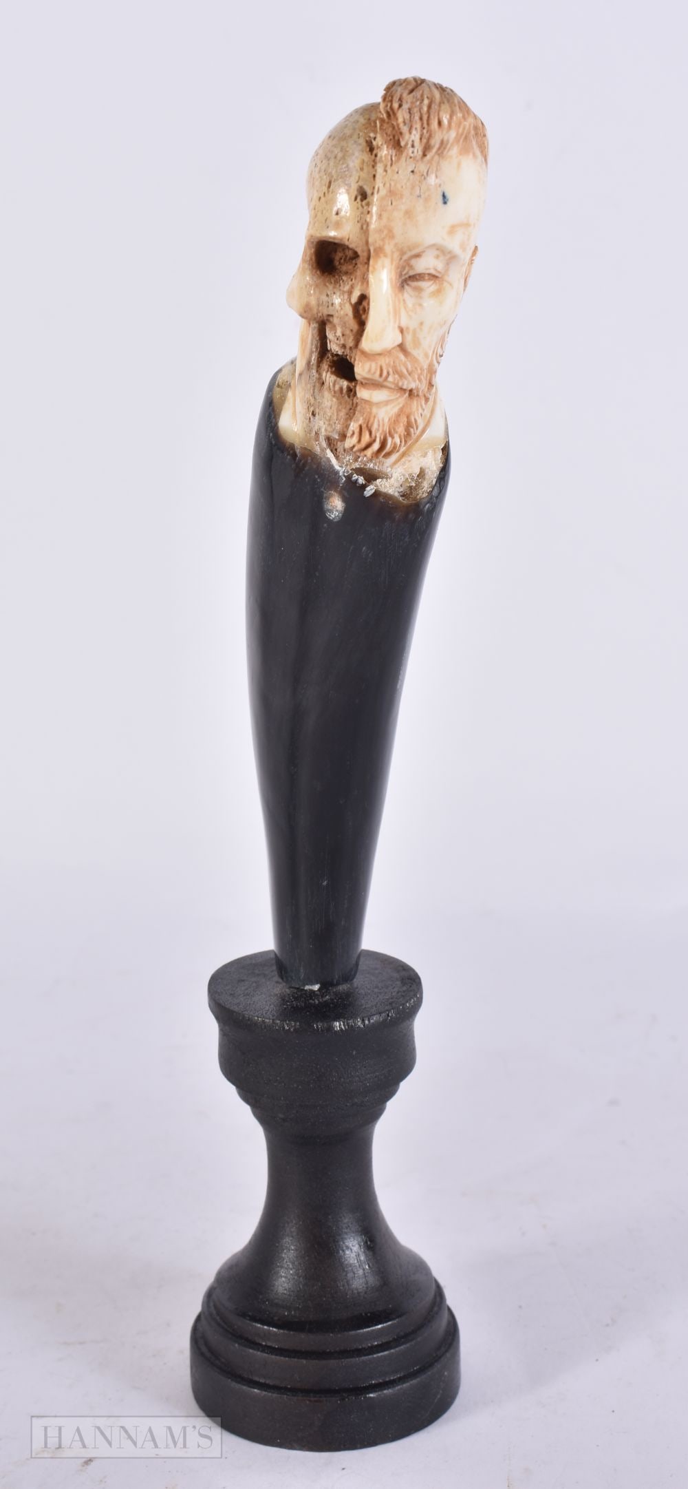 A CARVED HORN MEMENTO MORI SKULL SCULPTURE. 21 cm high. (1 of 5)
